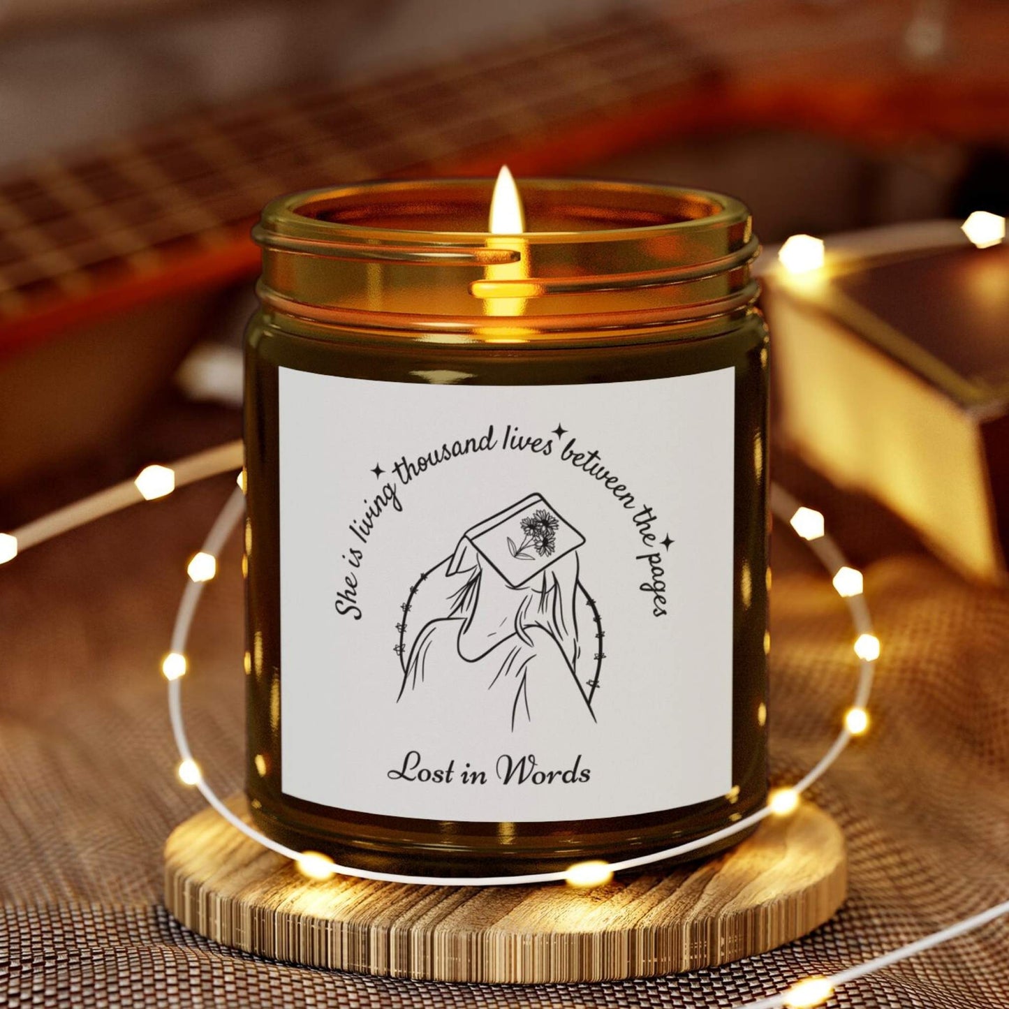 Book Lover Candle, 'She is living thousand lives between the pages, Lost in Words' with a girl and book illustration - amber jar candle for bookworms – cozy literary gift for readers and bookworms.