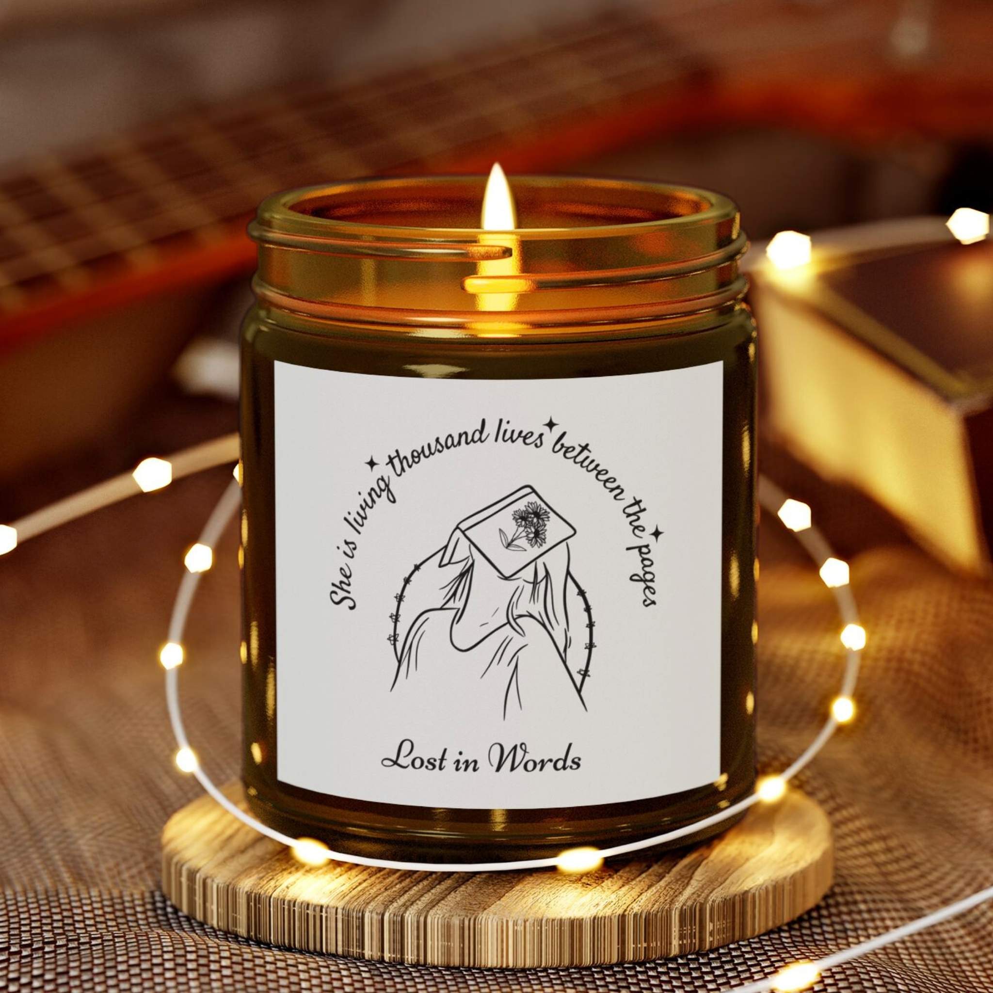 Book Lover Candle, 'She is living thousand lives between the pages, Lost in Words' with a girl and book illustration - amber jar candle for bookworms – cozy literary gift for readers and bookworms.