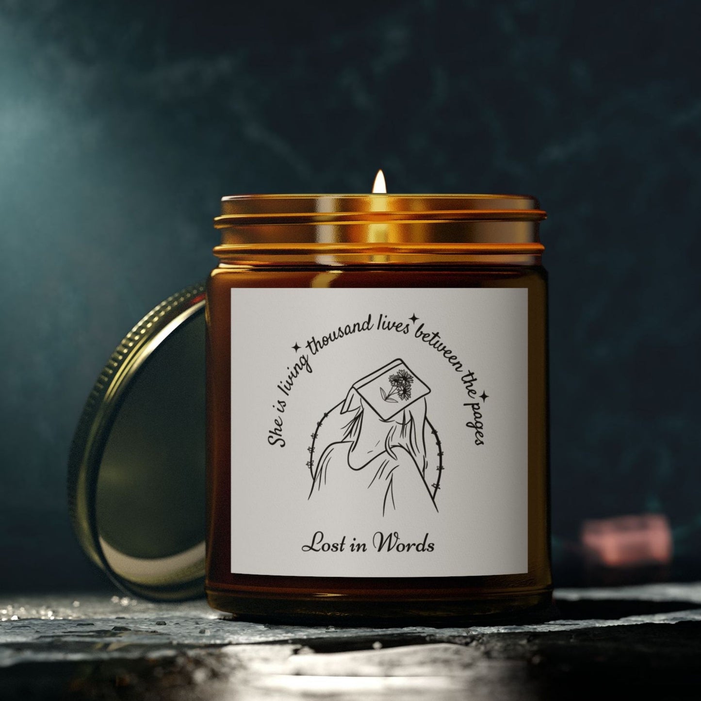 Book Lover Candle, 'She is living thousand lives between the pages, Lost in Words' with a girl and book illustration - amber jar candle for bookworms – cozy literary gift for readers and bookworms.
