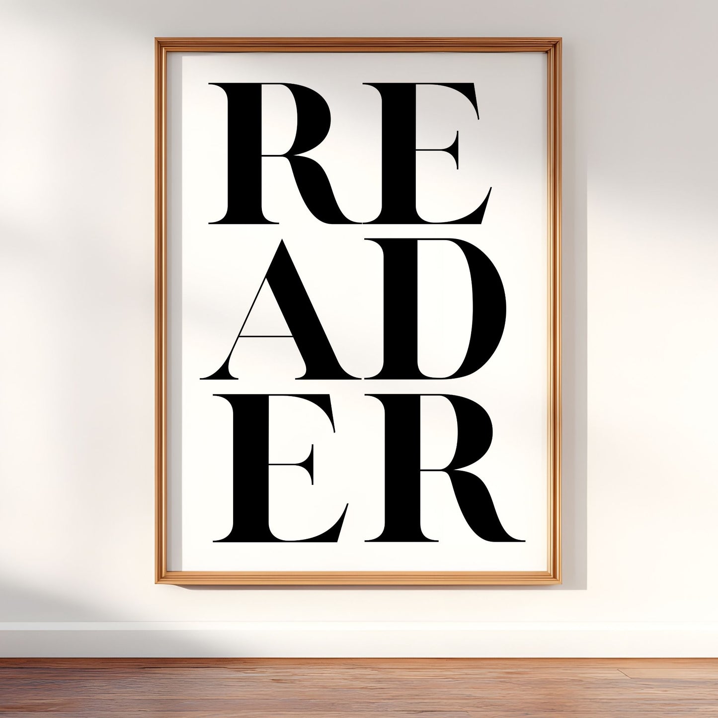 Framed poster 'READER' on a white background  – cozy reading nook and modern gallery wall digital artwork.